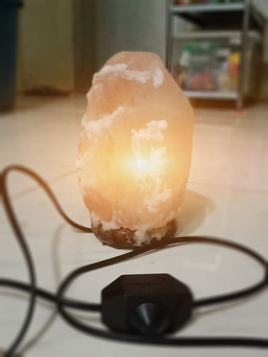 A Himalayan salt lamp glowing warmly